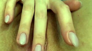 Amateur girl pleasures herself in close-up shot with fingers